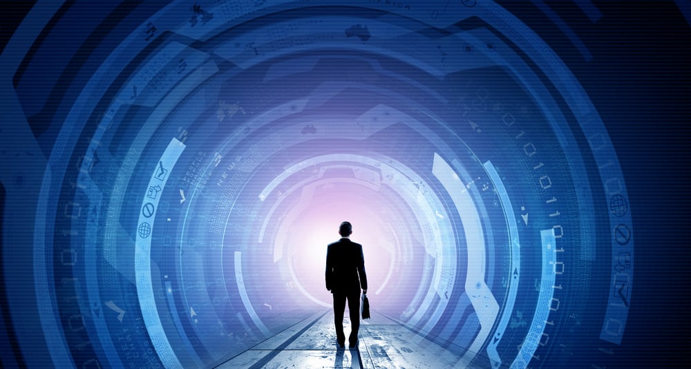 Back view of a businessperson standing in a futuristic tunnel to signify evolving technologies for our post about announcing ShardSecure 2.1.0