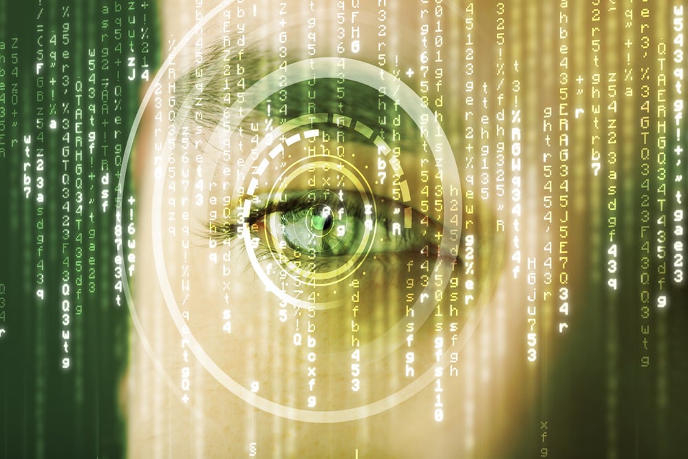 Close-up of a man's eye with a cyber overlay to suggest encryption technologies for our post on NIST and FIPS standards.