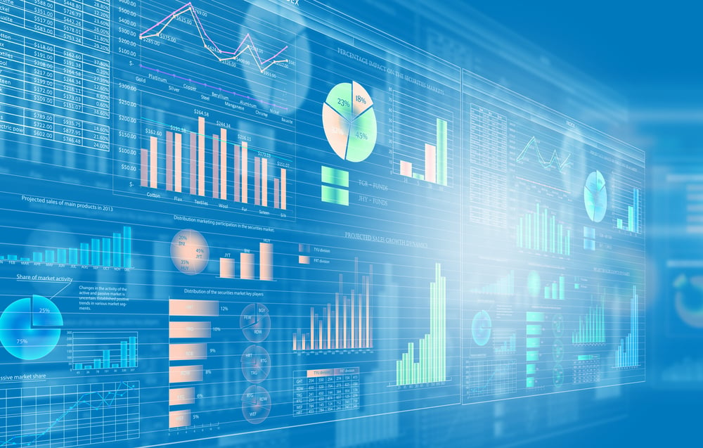 Blue background image of a media screen with diagrams and graphs to signify technological processes like those involved in SOC 2 compliance.