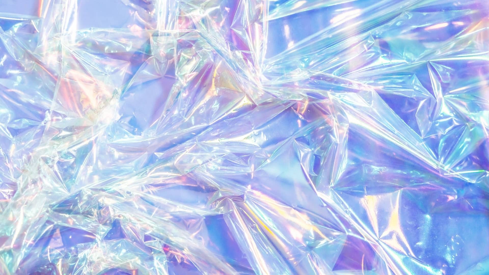 Crumpled iridescent holographic plastic resembling shards of glass.