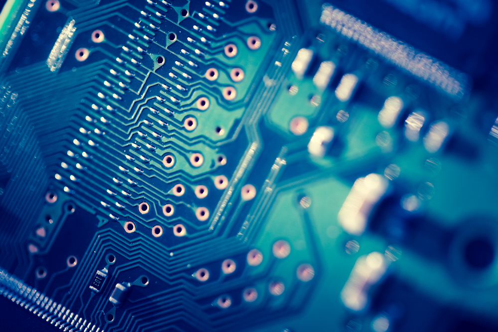 Closeup of a circuit board to signify one of the six steps for implementing privacy by design at your organization: adopting technical measures.
