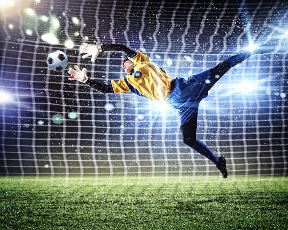 Goalkeeper making a save to signify data security through a soccer lens.