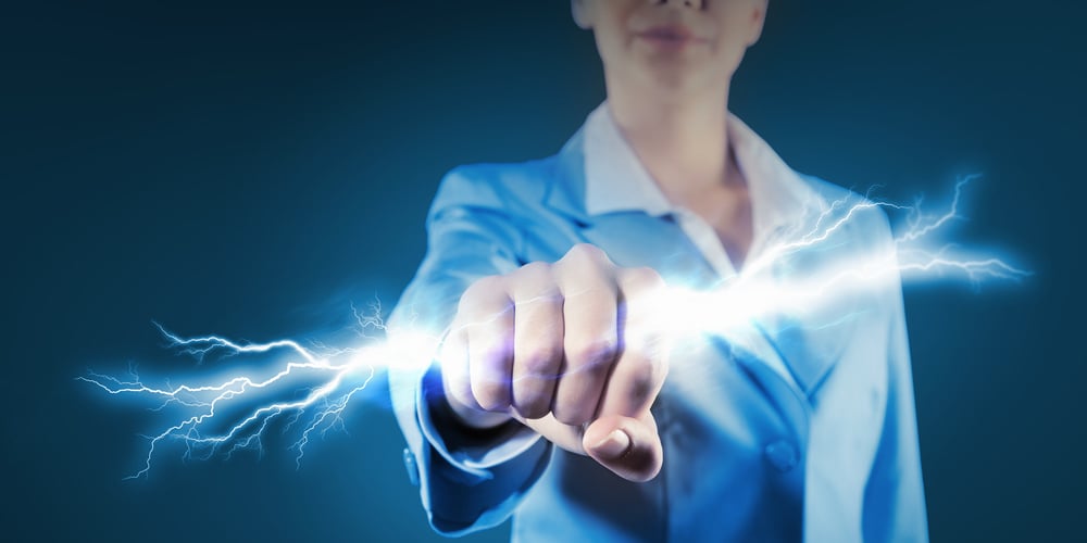 Closeup of a data resiliency expert holding a lightning bolt in her fist to illustrate our post on information resiliency: ensuring data's survival in the digital storm. 