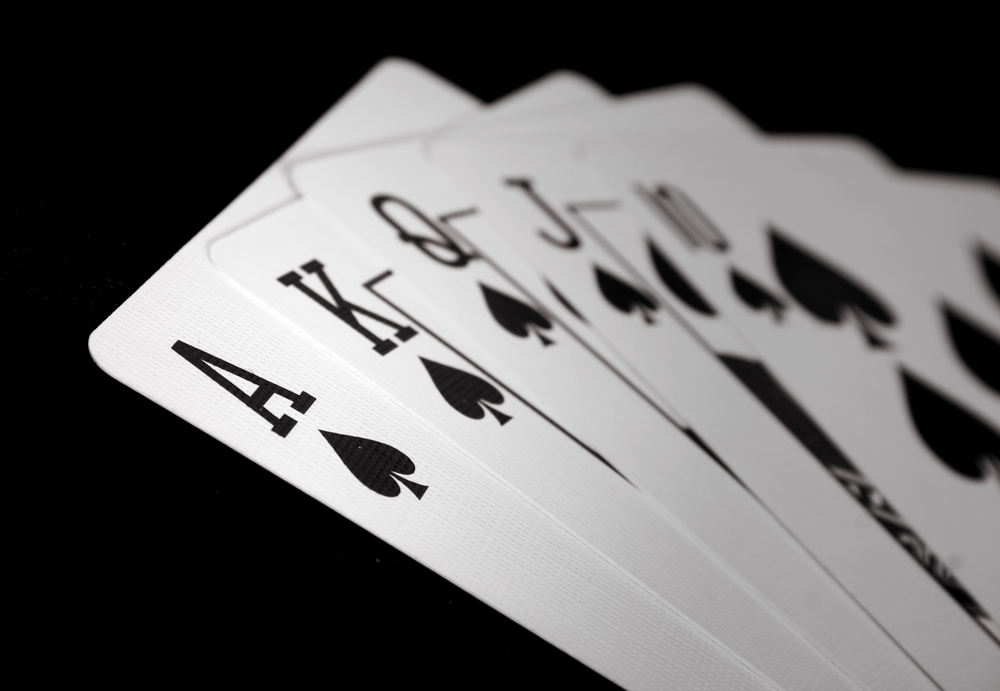 A closeup of a royal flush in spades to signify not gambling with your company's data security.